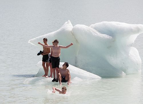 Alex Leckie-Zaharic does a victory dance. En Watanabe to the left, Marcus Beagley to the right and Angus Frew swims to shore and a warm dry top. 
