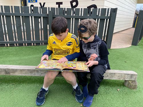 Bentley reading with his buddy Flynn