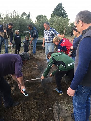 The Boys took turns to help scrape off the soil gently. 