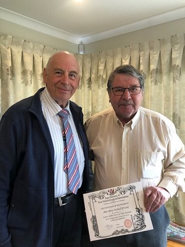 Alan Orchard, JP (retired) receiving his certificate from Registrar Ken Shields