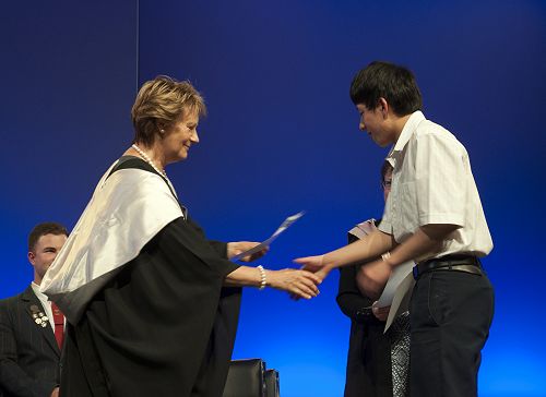 Prizegiving 2016: Jeffrey Chen receives four Excellence awards at Level 3, from Mrs Chris Stoop.