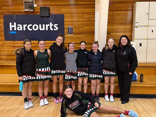 Ms Hunnikin with the girls after their game. 