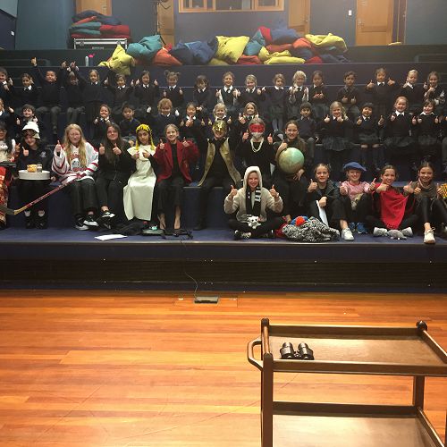 The cast and Years 0-2 in the Caroline Freeman Theatre