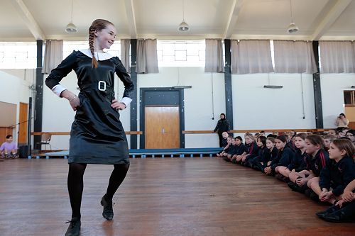Sacred Heart students entertained by Neave's singing & tap dancing performance in the role of 'Tuesday Addams'