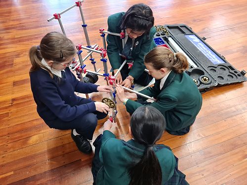 Gemma, Sarina, Lydia and Miya work through the complexities of a self-raising footrest