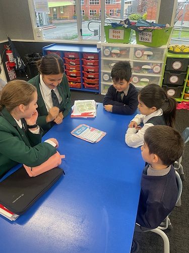 Year 9 class sharing their stories with Year 1-2 Students