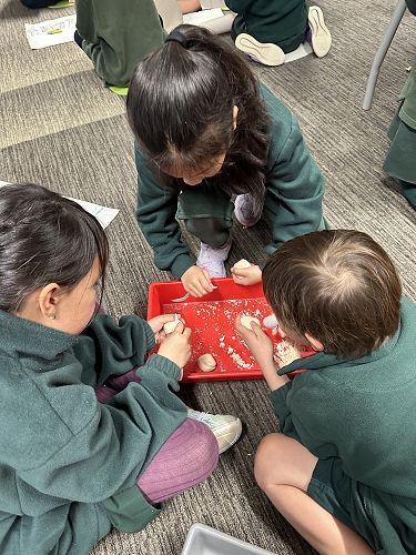 Savanah, Mia and Harry R working on their soap carving.