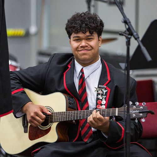 Year 12 student Heinrich Muller on guitar.