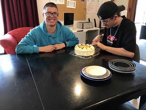 Ryan and Thomas cutting the cake