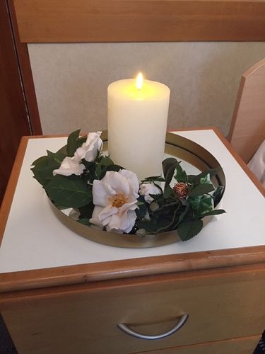 A remembrance candle which is part of the End of Life kits. The remembrance candle will offer comfort and peace to families after the resident has passed.