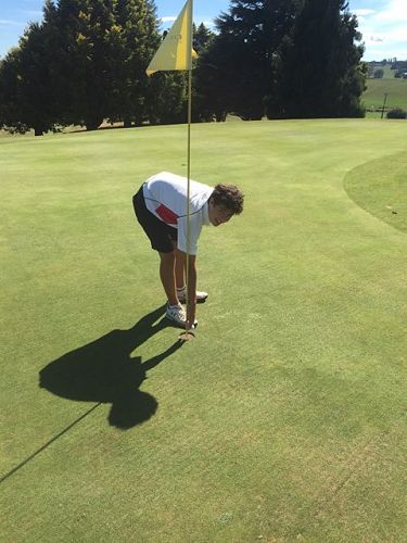 Ricci Putohe Yr 11 - Pulls ball out of the hole after hitting a hole in one, to send his semi-final into a playoff.