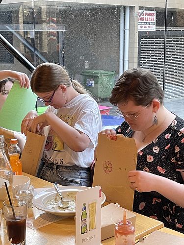Jessie Avison and Molly Somerfield opening their time capsules