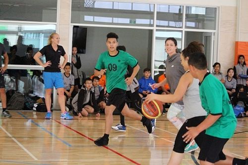Miss B & Kat showing their skills during a basketball match.  