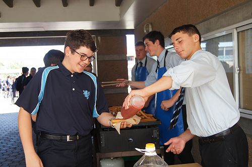 Head Boy, Nathan Hastie and his Leadership Team serve lunch to the Year 9 students