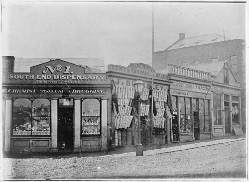 The shops at the corner of Princes and Walker Street (now Carroll Street) about 1863 