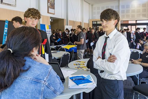 Thomas Woodgate, left, and Tosh Burak, speak with psychologist Jade McDowall.