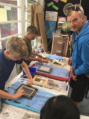 Jake taking the frame of his paper.