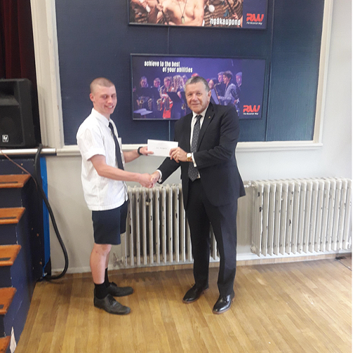Geoff
Cain from the Riccarton Unity Freemasons Lodge presents Liam MacKechnie with his scholarship cheque. 
