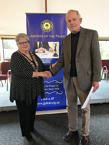Robert Sloss receiving his 30 year Long Service Certificate from Royal Federation President Denise Hutchins