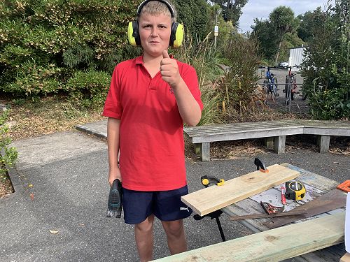 Mitch begrudgingly gives a thumbs up as he would prefer to get back to using his jigsaw to cut pieces out for his bird house 