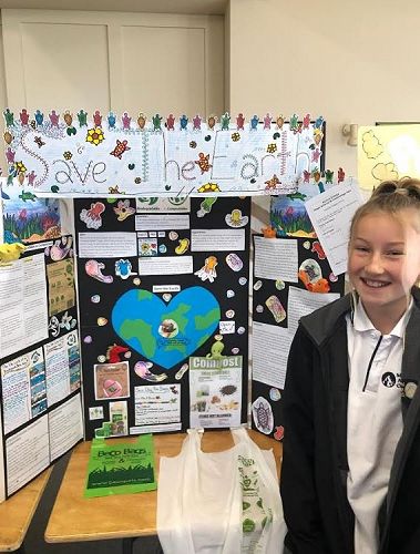 Taja Rowan with her Save The Earth masterpiece 