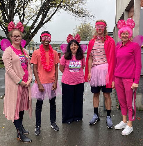 Sea of Pink: Centre of Wellbeing staff with representatives from the Student Wellbeing Committee, Stefan Marasinghe Arachchige Don (left) and Ryan Wilson.