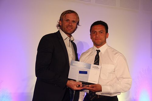 Scott Roberston presents Ereatara Enari with his Lincoln University Blue for Rugby