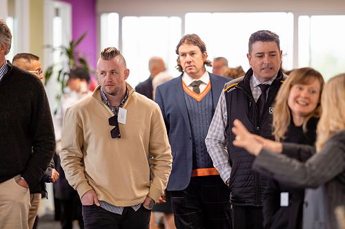 Staff and guests make their way through the building