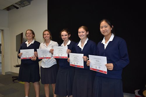 Students from 9CLJ receiving participation certificates for Joint Online Thai classroom project