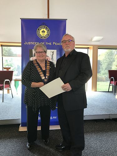 Paul Tate JP (Retired) Receiving his Royal Federation Certificate & Lapel Badge from National President Denise Hutchins