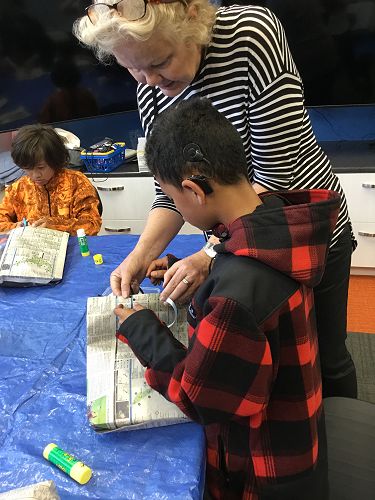 Daequan, Jan making recycled paper bags