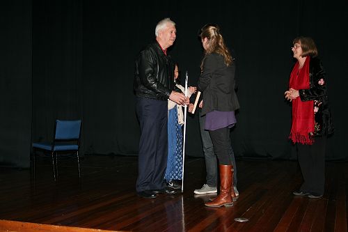 Peter Neville receiving a gift from our Head Prefects