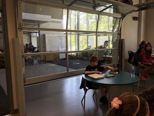 Fold down transparent roller door allows for quiet (or noisy!) work 