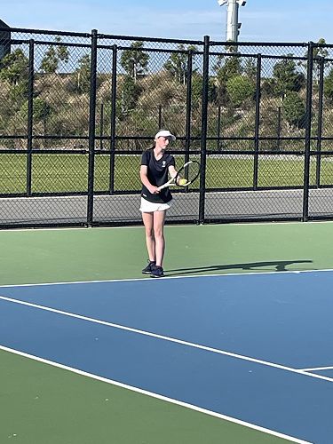 Alexi Sheehan lining up to serve