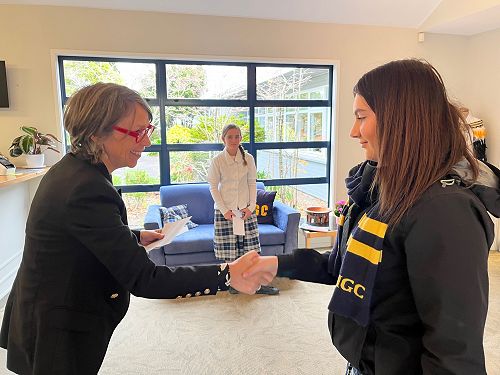Mary-Jeanne Lynch presents a prize to Janaya Cohen after attending the Future of Work conference.