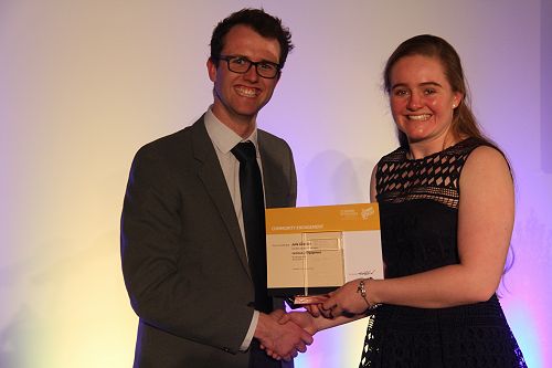 Danyon Thomas presents Julie Gillespie with her Gold Award for Community Engagement