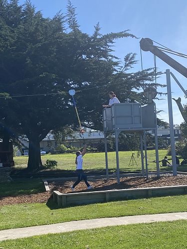 Jasmine passing the rope to Vivienne for a quick getaway