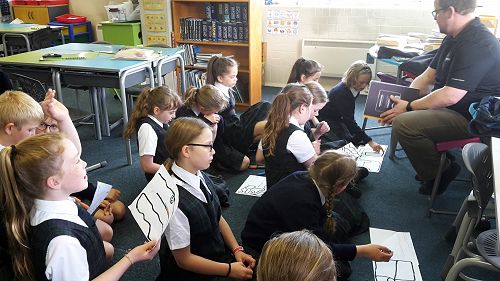 Mr Breese checking out each groups code.