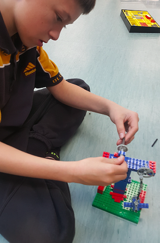 Kyle- the lego master hard at work.