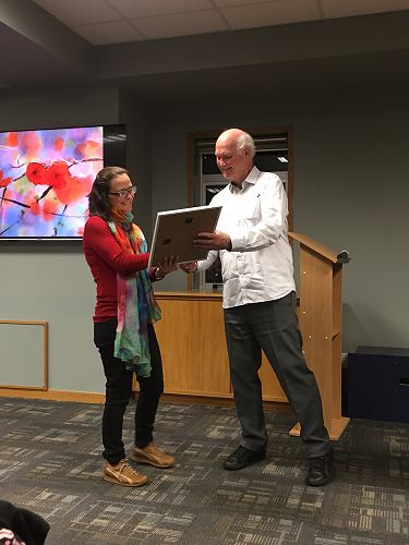 Neil Darragh presenting a certificate to Kaaren Mathias for writing for Tui Motu magazine each month since August 2005