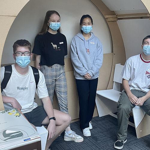Product Design students in a sound pod prototype they designed
