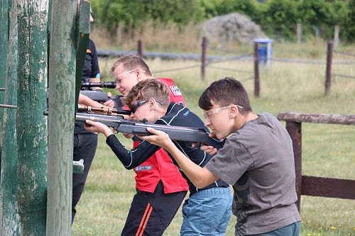 Elijah, Addison and Ethan taking aim  with the air rifles