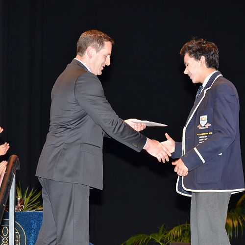 Greg Easton presenting  the Stephen Guest Scholarship prize to Shaan Kumar. 