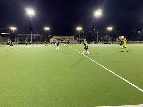 The Second XI under lights in the late game.