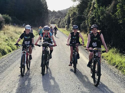 The winning South Island Secondary School adventure race team biking their final leg of therace (South Island Secondary Schools Adventure Race 2019)