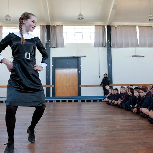 Sacred Heart students entertained by Neave's singing & tap dancing performance in the role of 'Tuesday Addams'