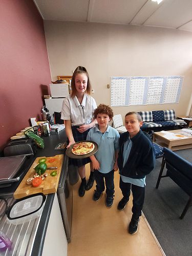 Rylee Hunter and Jonah consolidate fraction work by making a pizza