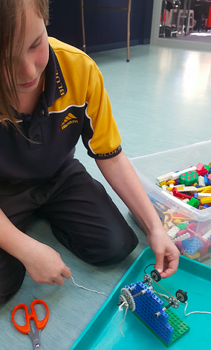 Can MacKenzie work out a pulley system in time?