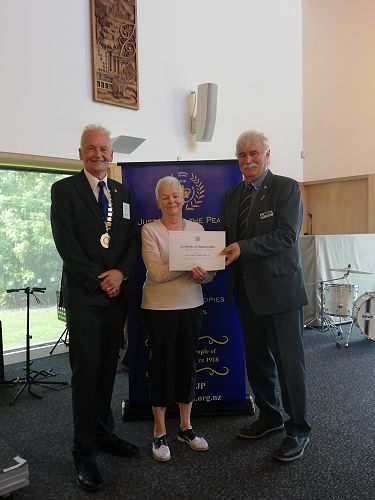 Mary Corbett receiving her certificate for 30 years of service from Graeme Barber and Southern Regional Rep Lindsay Dow