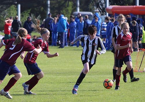Jessie Christie chases the football.